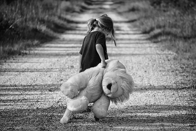 Sad Child With Large Stuffed Animal