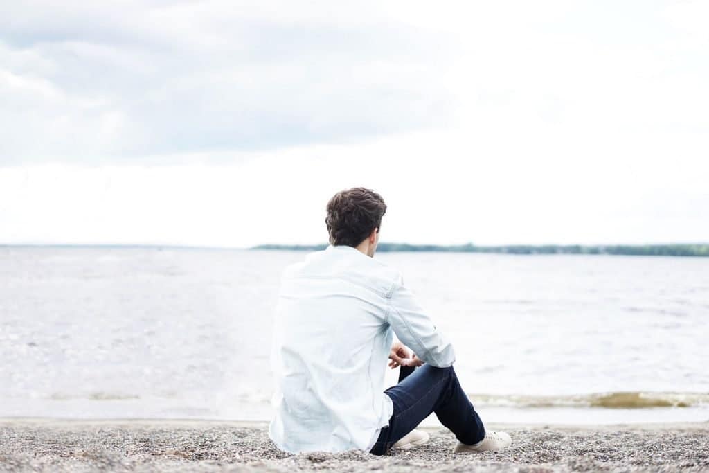 Man Staring Out At The Ocean