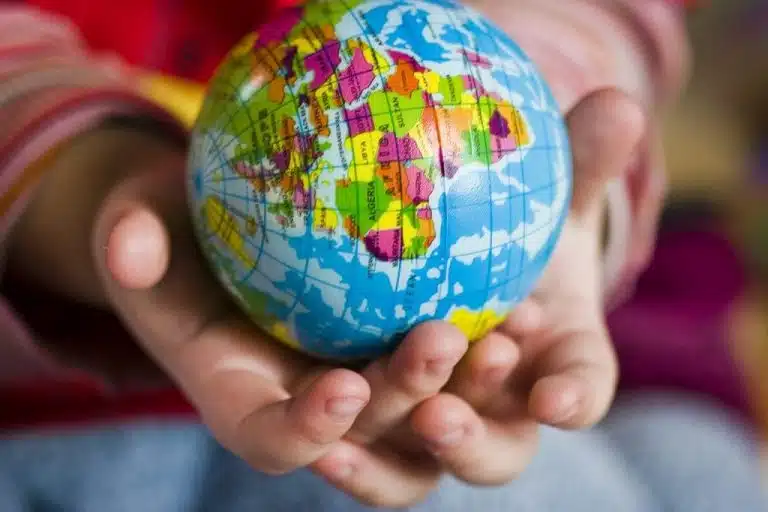 Child Holding A Globe