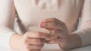 Woman's Hand Removing Wedding Ring