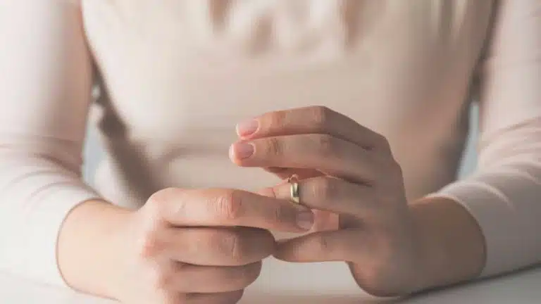 Woman's Hand Removing Wedding Ring