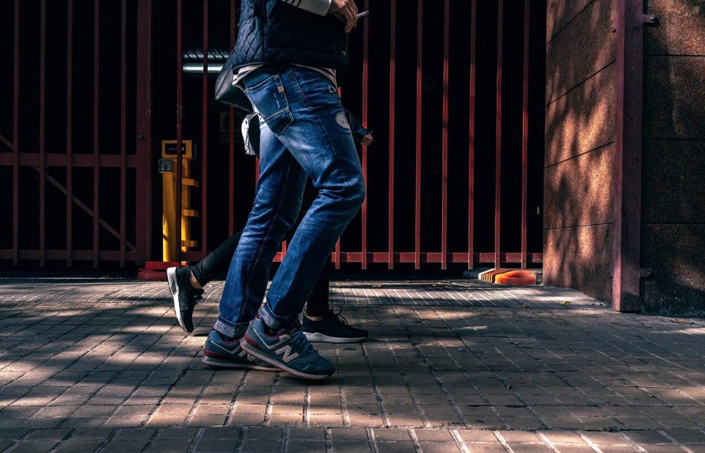 Two People Walking In City