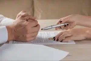 Couple Signing Divorce Paper