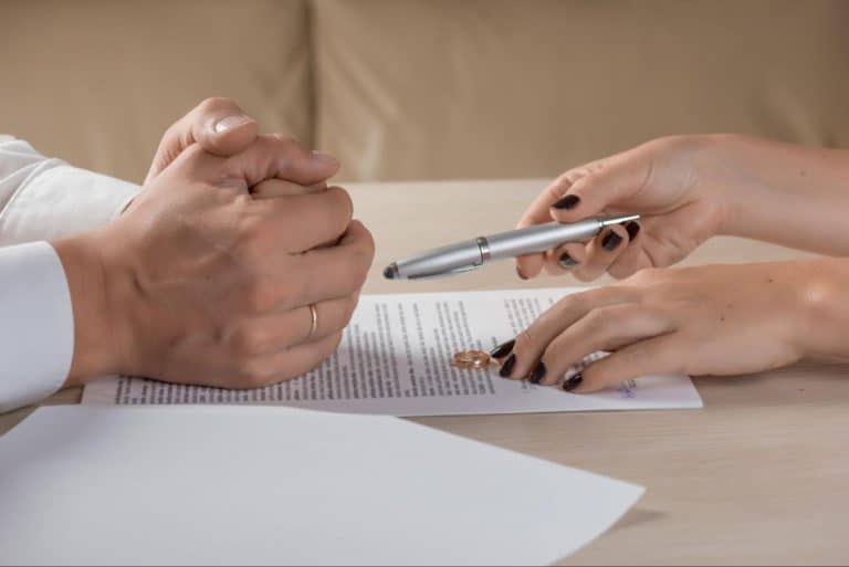 Couple Signing Divorce Paper