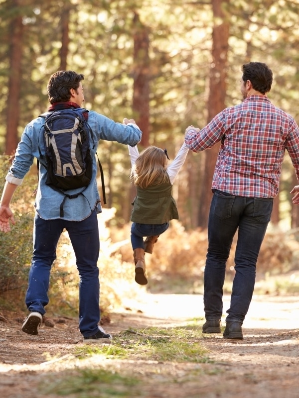 Gay Male Couple With Daughter Walking