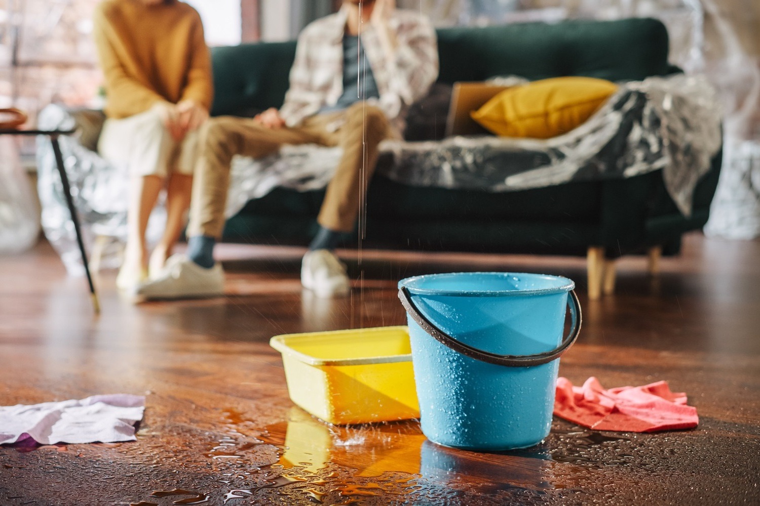 Water Drips into Buckets in Living Room