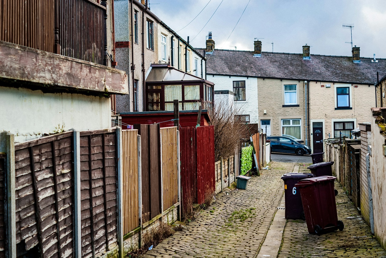 Backstreet With Fence That Needs Repair