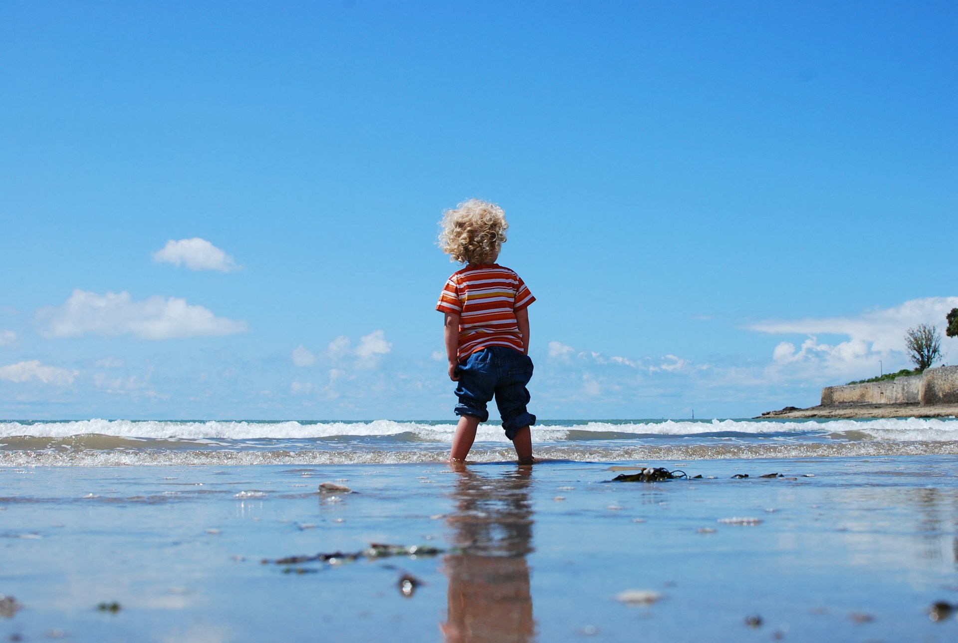 Child Playing In Sea