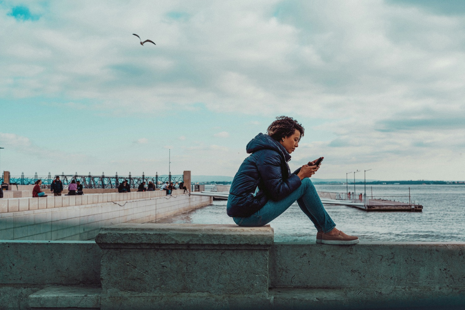 Woman Estimating Divorce Settlement on Phone