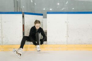 Girl Putting on Ice Skates