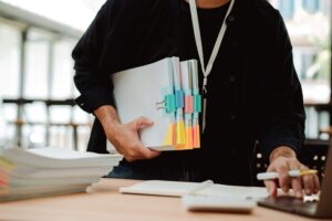 employee working with a large number of documents