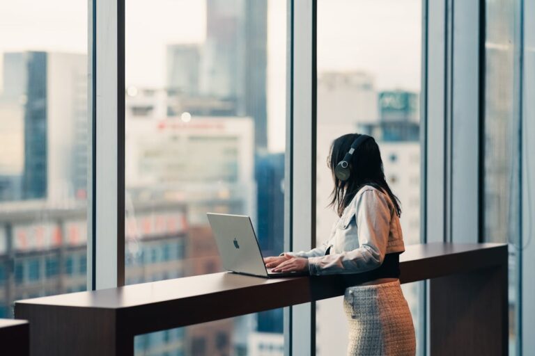 Business woman using a laptop in an office