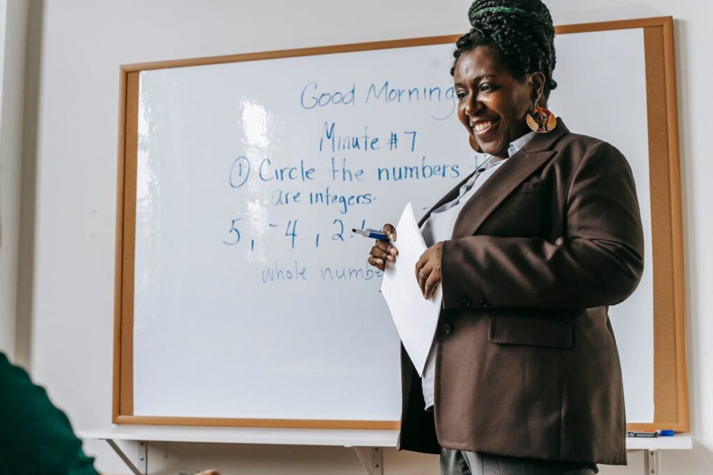 Teacher Next to Whiteboard