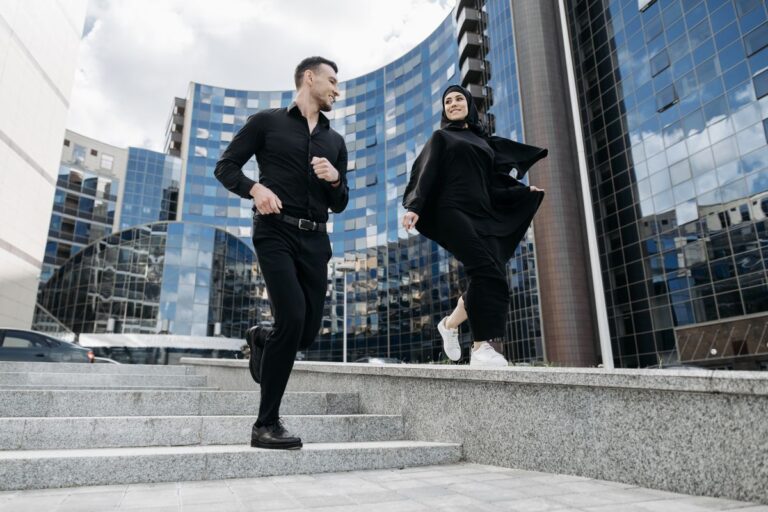 couple walking near buildings