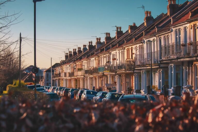 row townhouses with parked cars