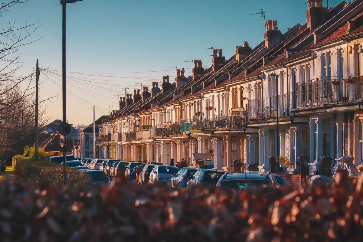 row townhouses with parked cars