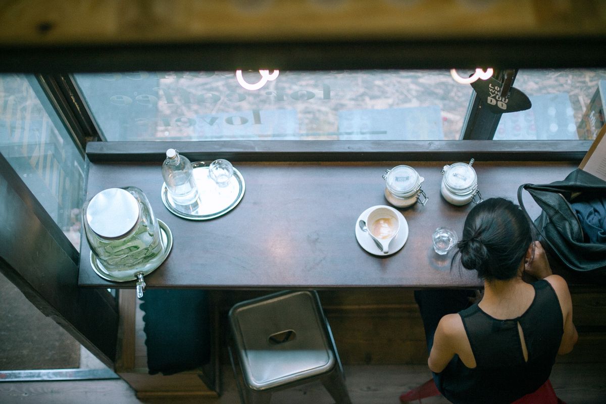 woman in coffee shop from above