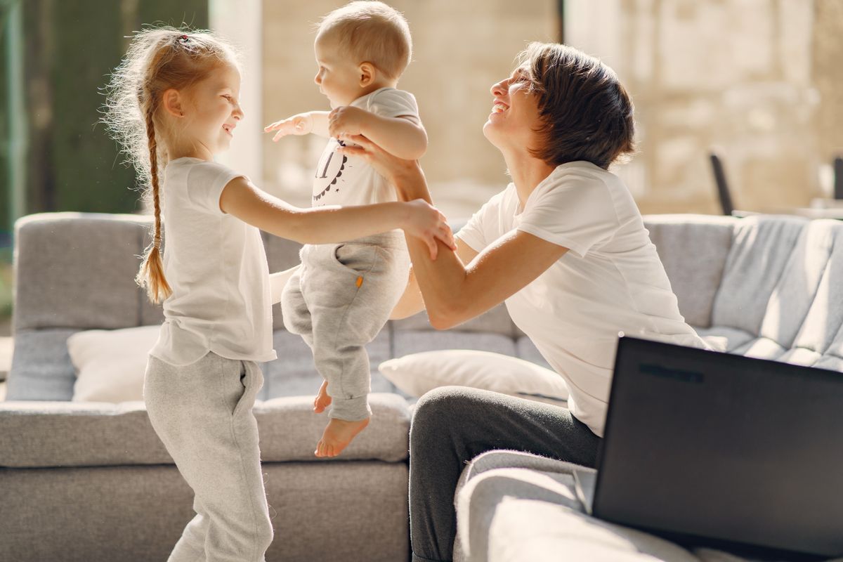 mum and two kids playing