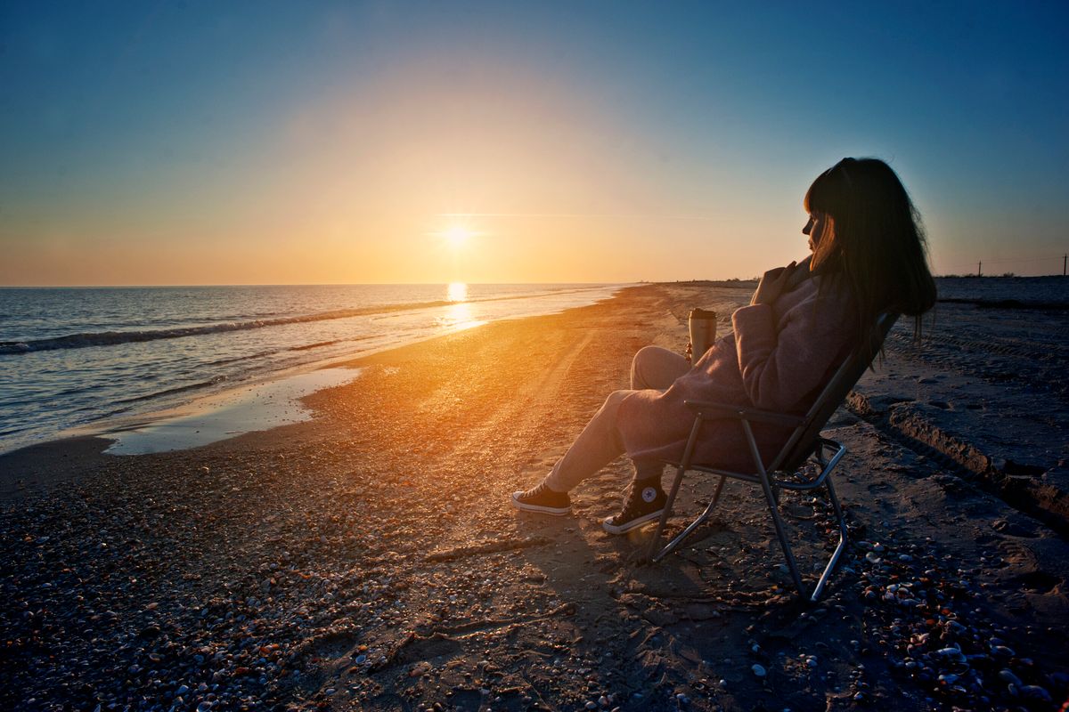 woman sitting on a beach chair