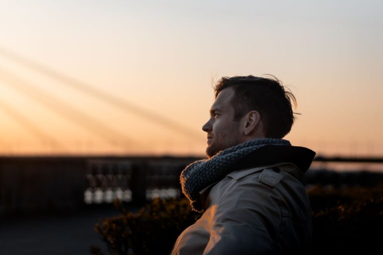 man enjoys a tranquil moment at sunset outdoors