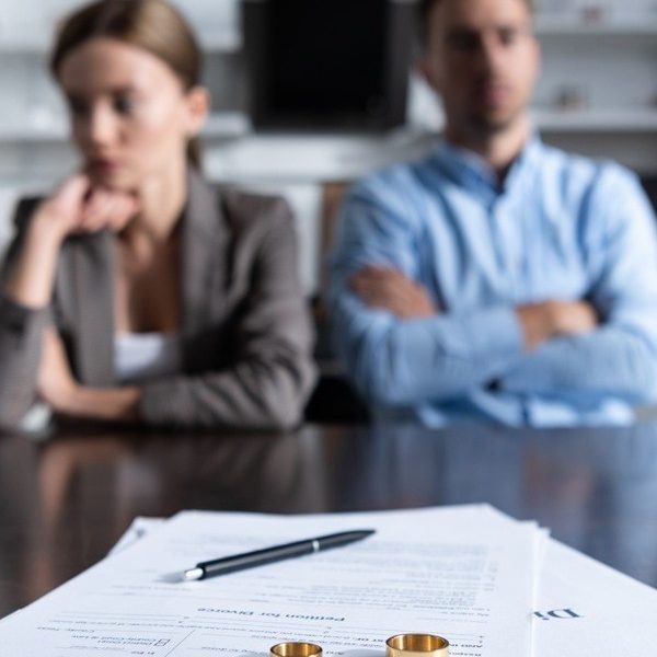 Couple speaking with a divorce solicitor in Wimbledon about their finances