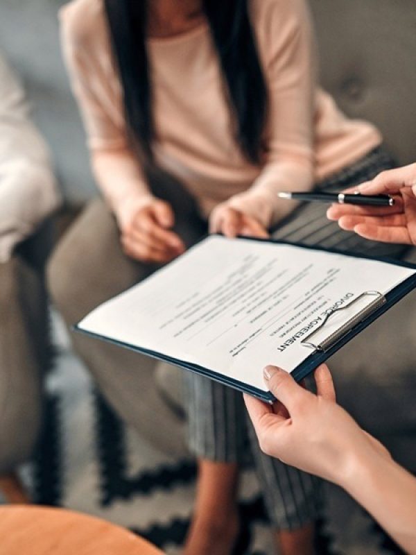 Couple Signing No-Fault Divorce Paperwork
